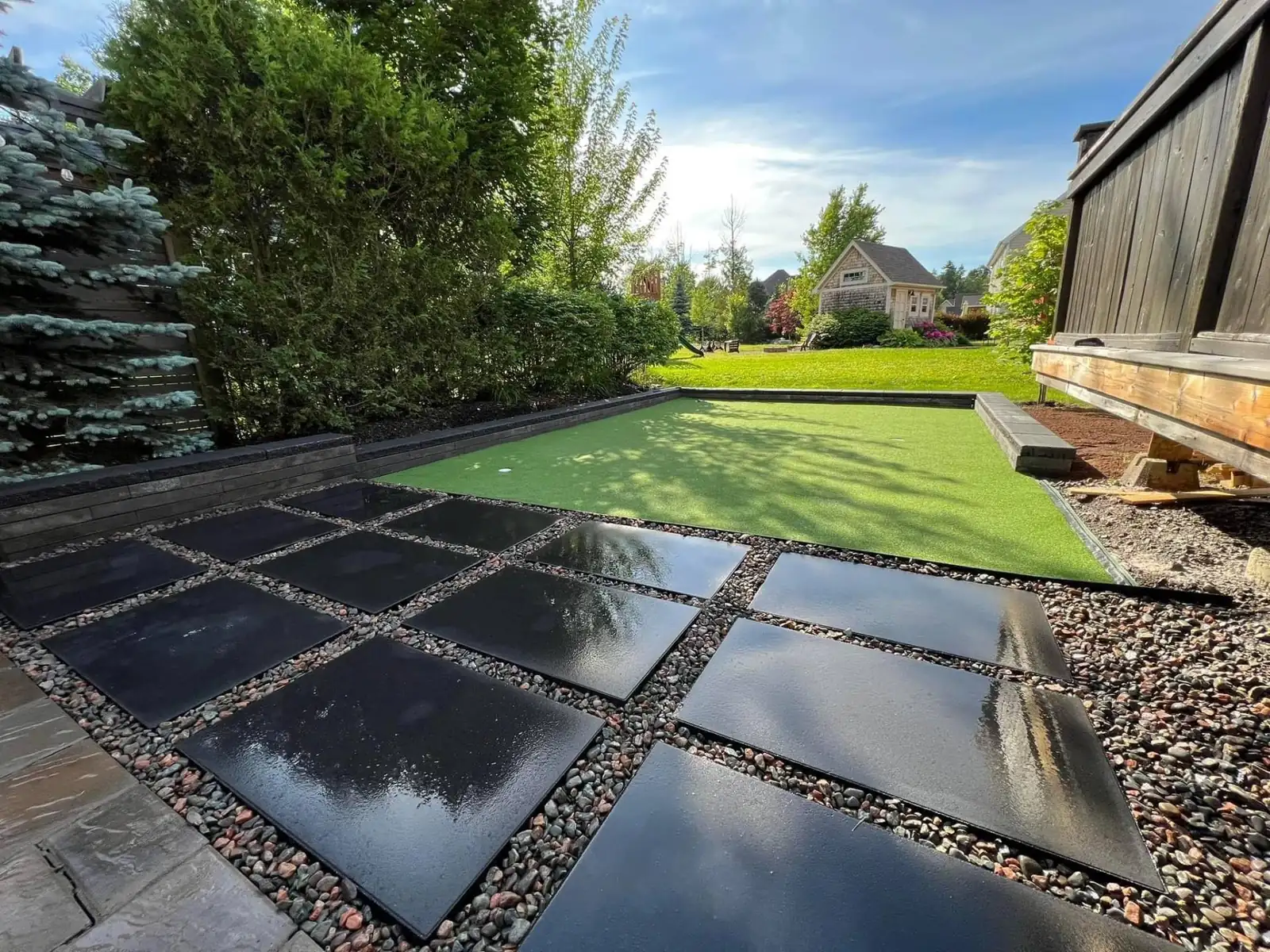 Black Pavers with Artificial Turf - Northwood Landscaping project in Greater Vancouver