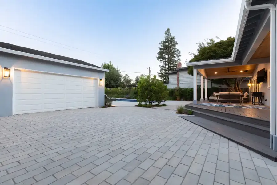 Interlocking paver driveway with covered patio in Greater Vancouver