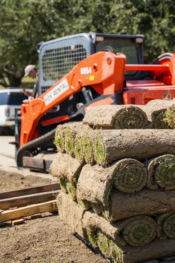 Stacked sod rolls ready for professional installation in Greater Vancouver
